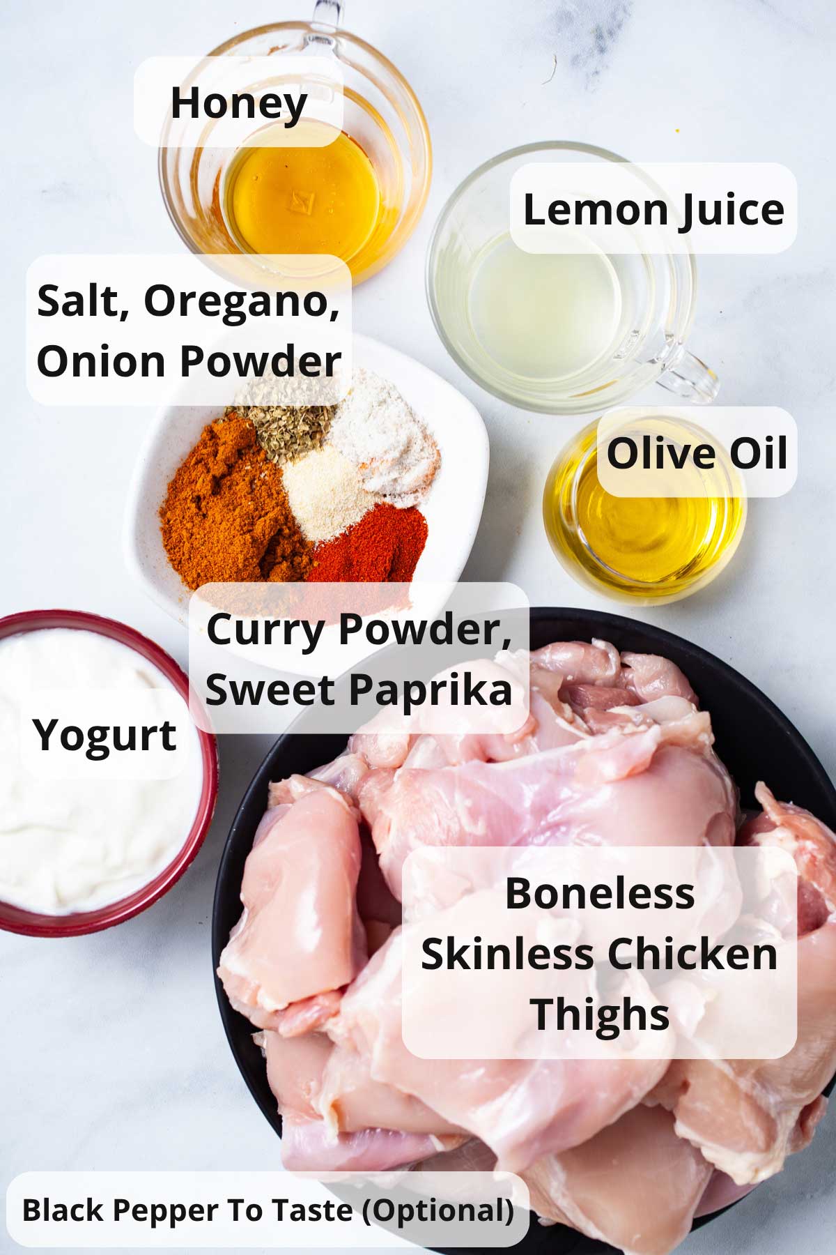 Ingredients to make baked boneless skinless chicken thighs with yogurt and curry.