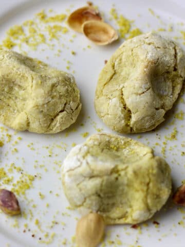 A plate with baked pistachio cookies.