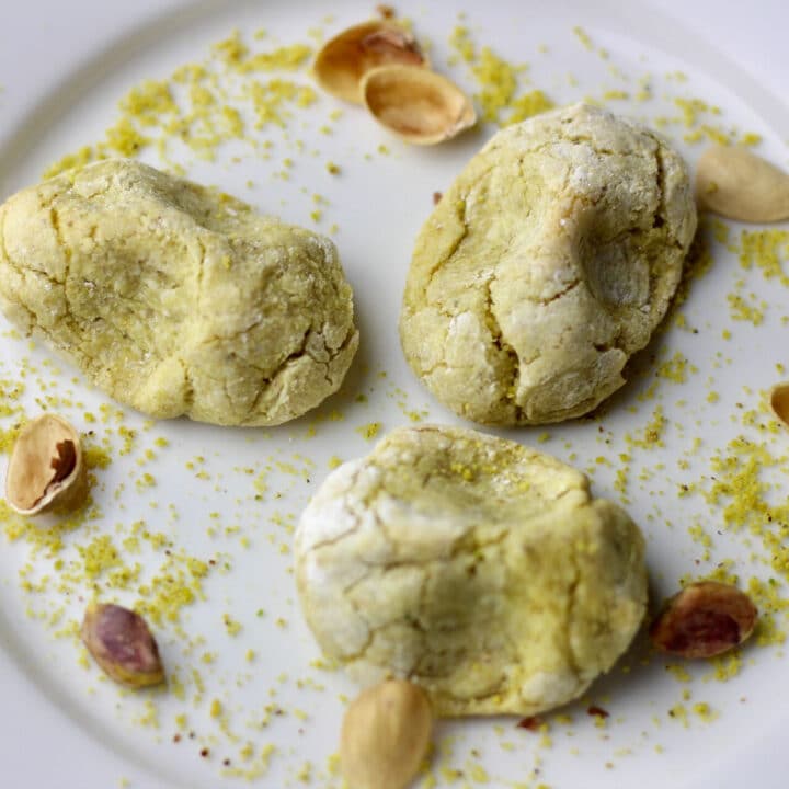 A plate with baked pistachio cookies.