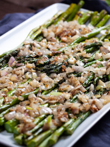 ROASTED ASPARAGUS WITH BUTTERED SHALLOTS & GARLIC SCAPES