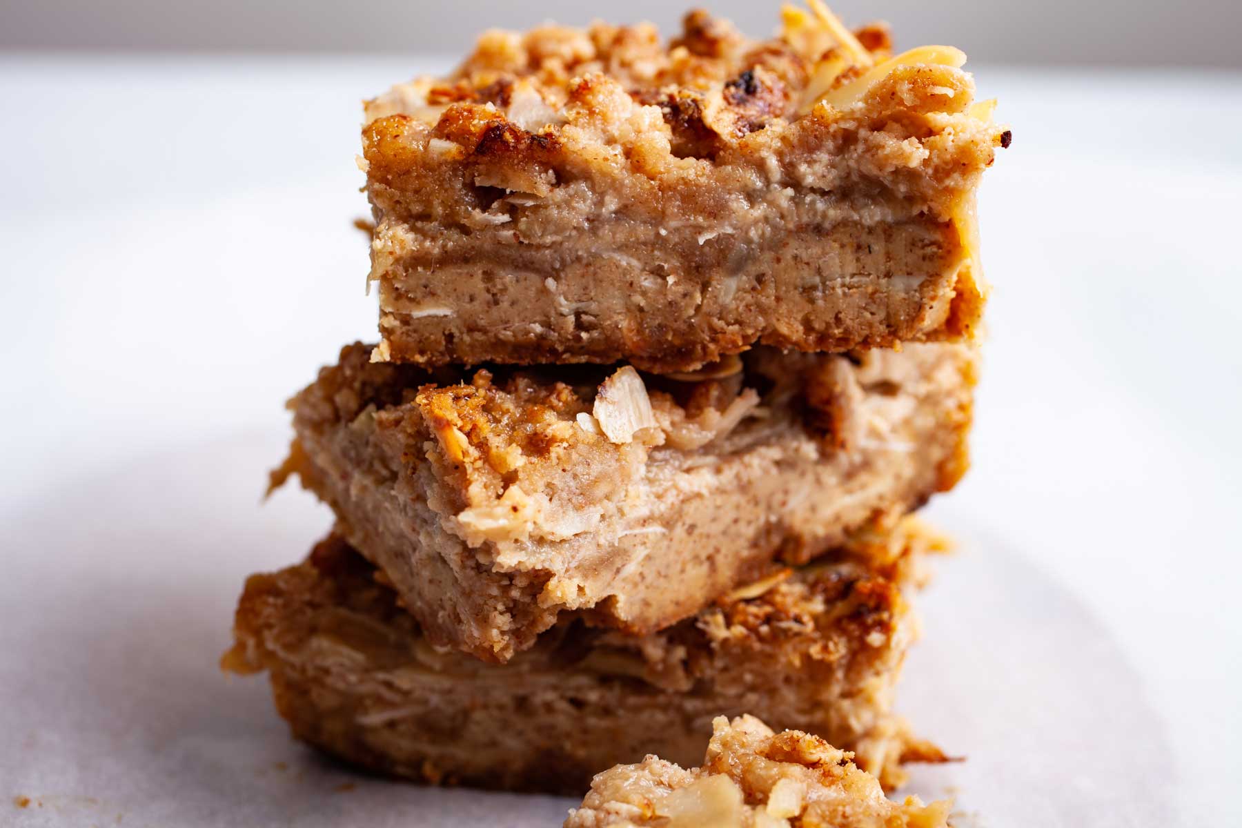 Almond flour rhubarb cookie bars stacked on top of each other.