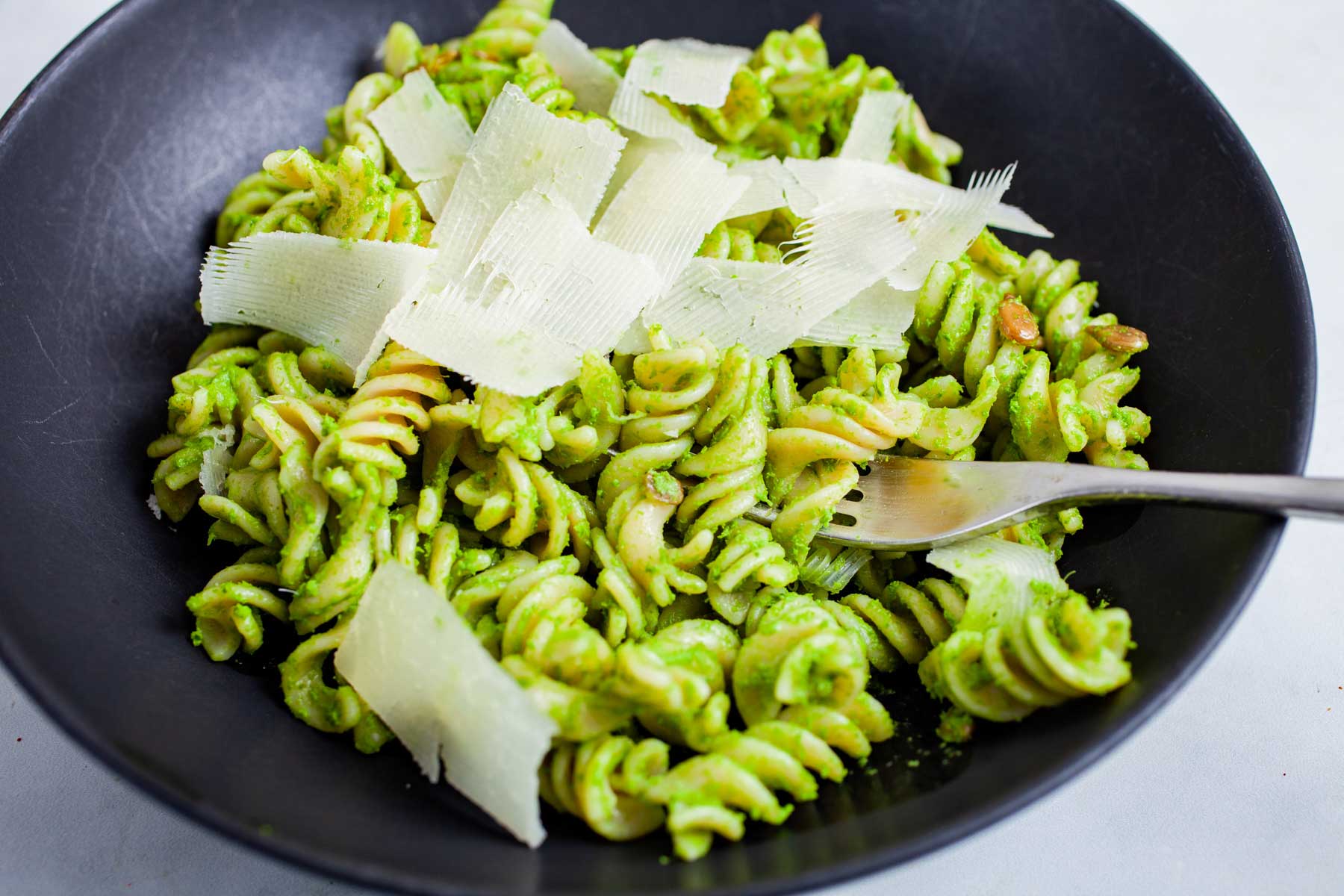 Anchovy pasta topped with cheese.