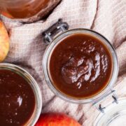 Apple butter stored in glass jars.