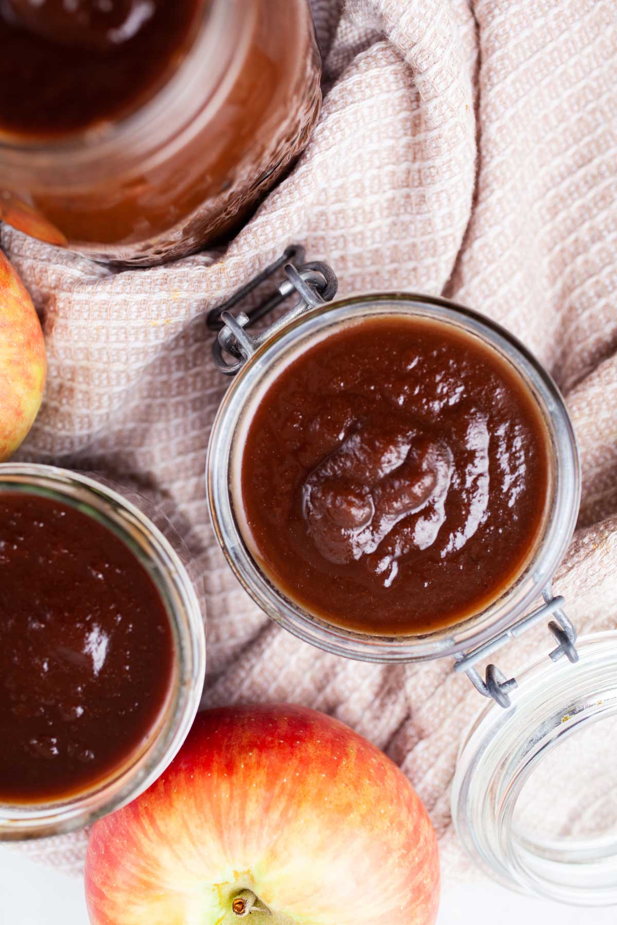 Apple butter stored in glass jars.
