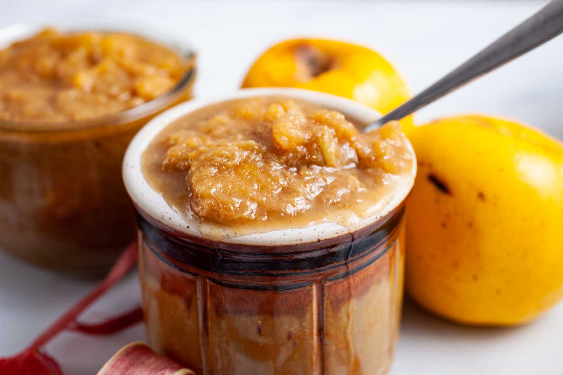 Apple rhubarb compote served in a small honey jar.