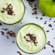 Avocado apple smoothies garnished with chocolate bits.