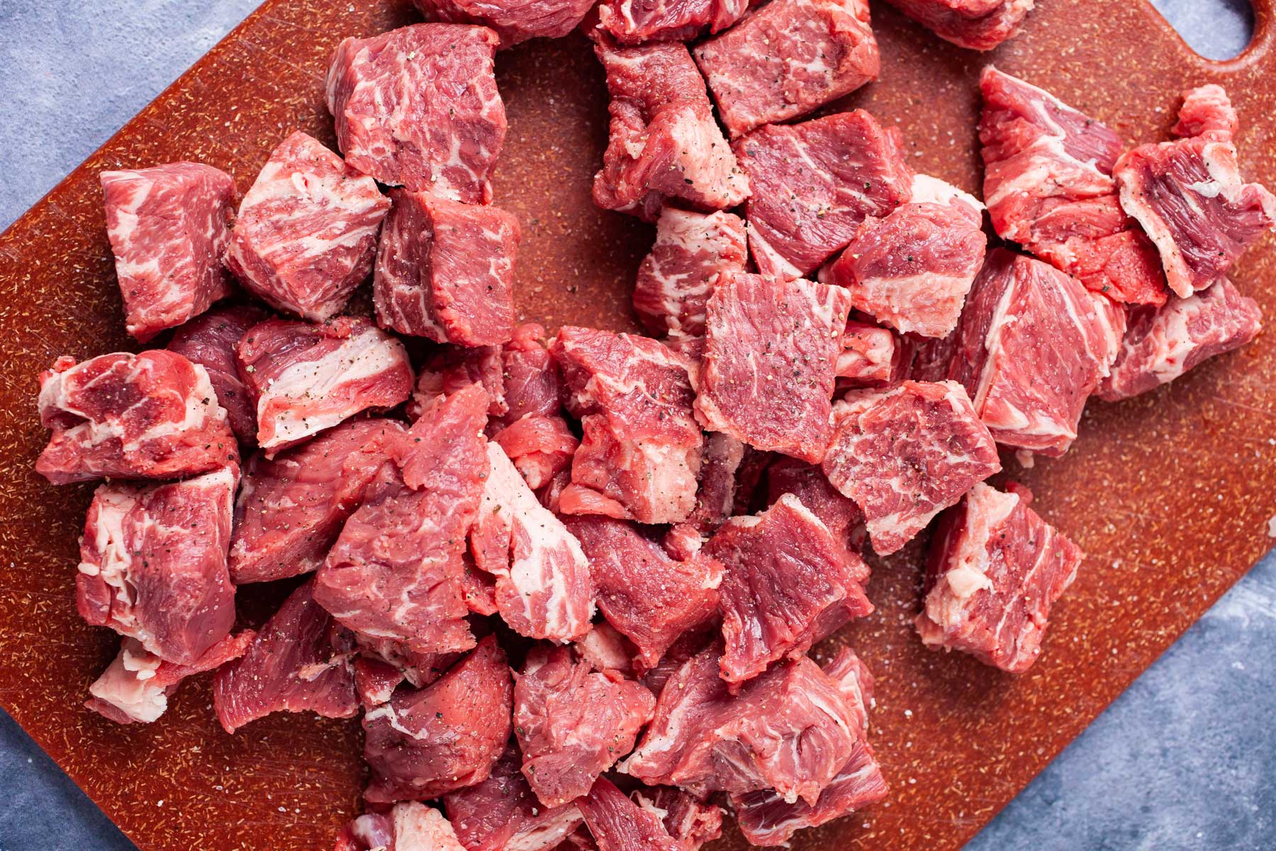 Chopped raw beef on a cutting board.