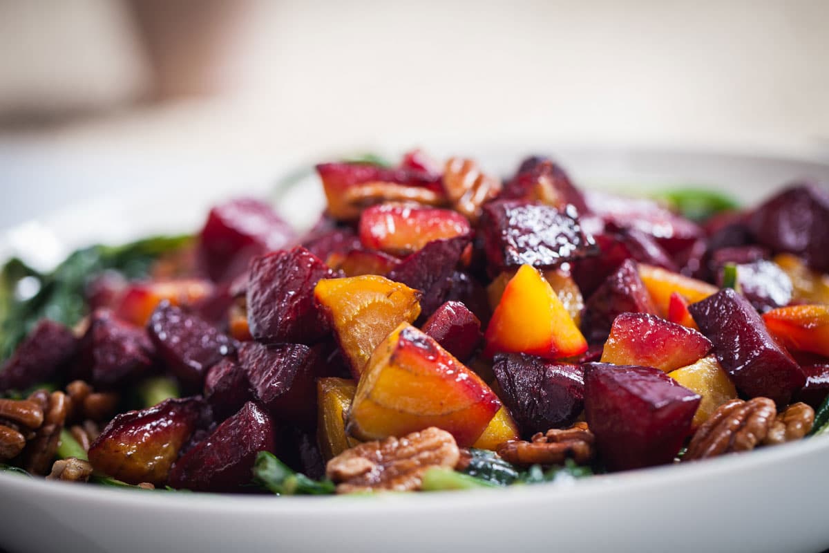 Roasted red and golden beets with pecans and greens.