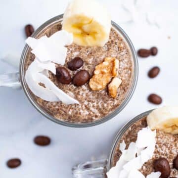 Coffee chia seed pudding in mini cups, topped with walnuts, chopped banana, and coconut flakes.