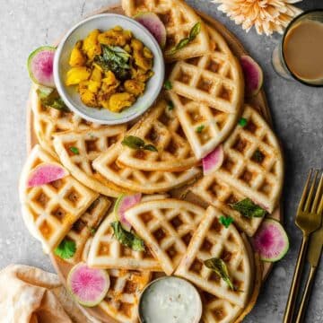 Dosa waffles beautifully arranged on a board.