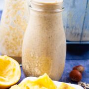 Creamy green banana smoothies on a table.