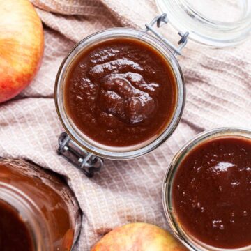 Apple butter stored in glass jars.