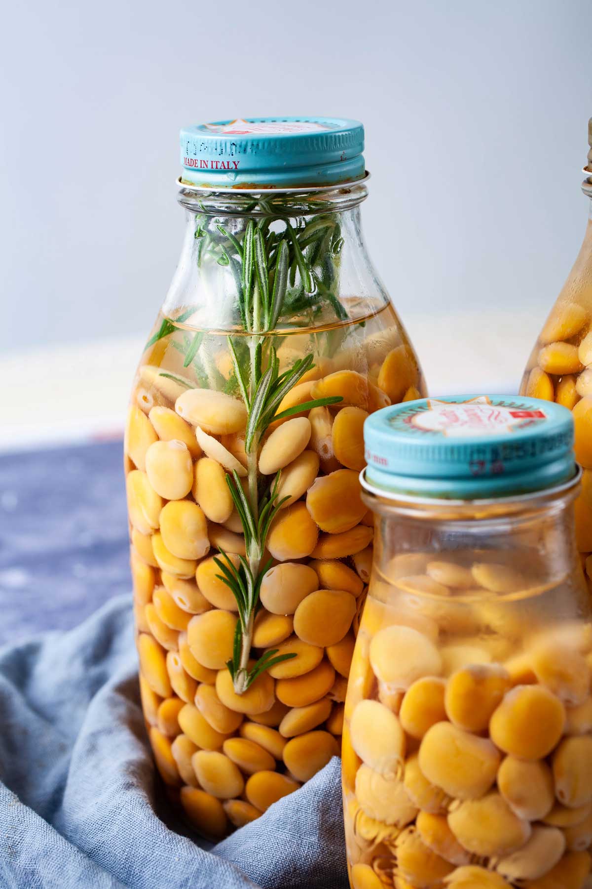 Lupini beans soaked in brine in mason jars with a lid.