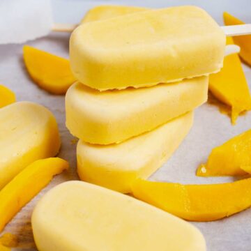 Stacked mascarpone mango popsicles.