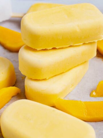 Stacked mascarpone mango popsicles.