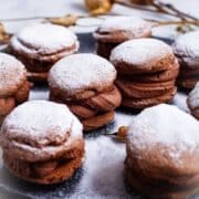 A large plate with festive mascarpone filled sandwich cookies.