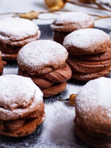 A large plate with festive mascarpone filled sandwich cookies.