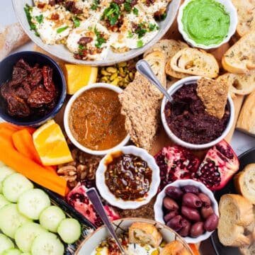 An assortment of Mediterranean plates on a grazing board.