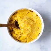 Mashed plantains in a bowl.