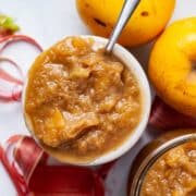 Apple rhubarb compote served in a honey jar.