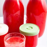 Watermelon and ginger juice in glass bottles.