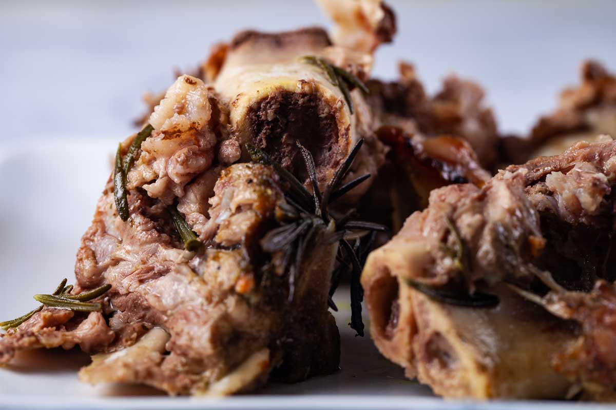 A close up of slow cooked beef bones and bone marrow.