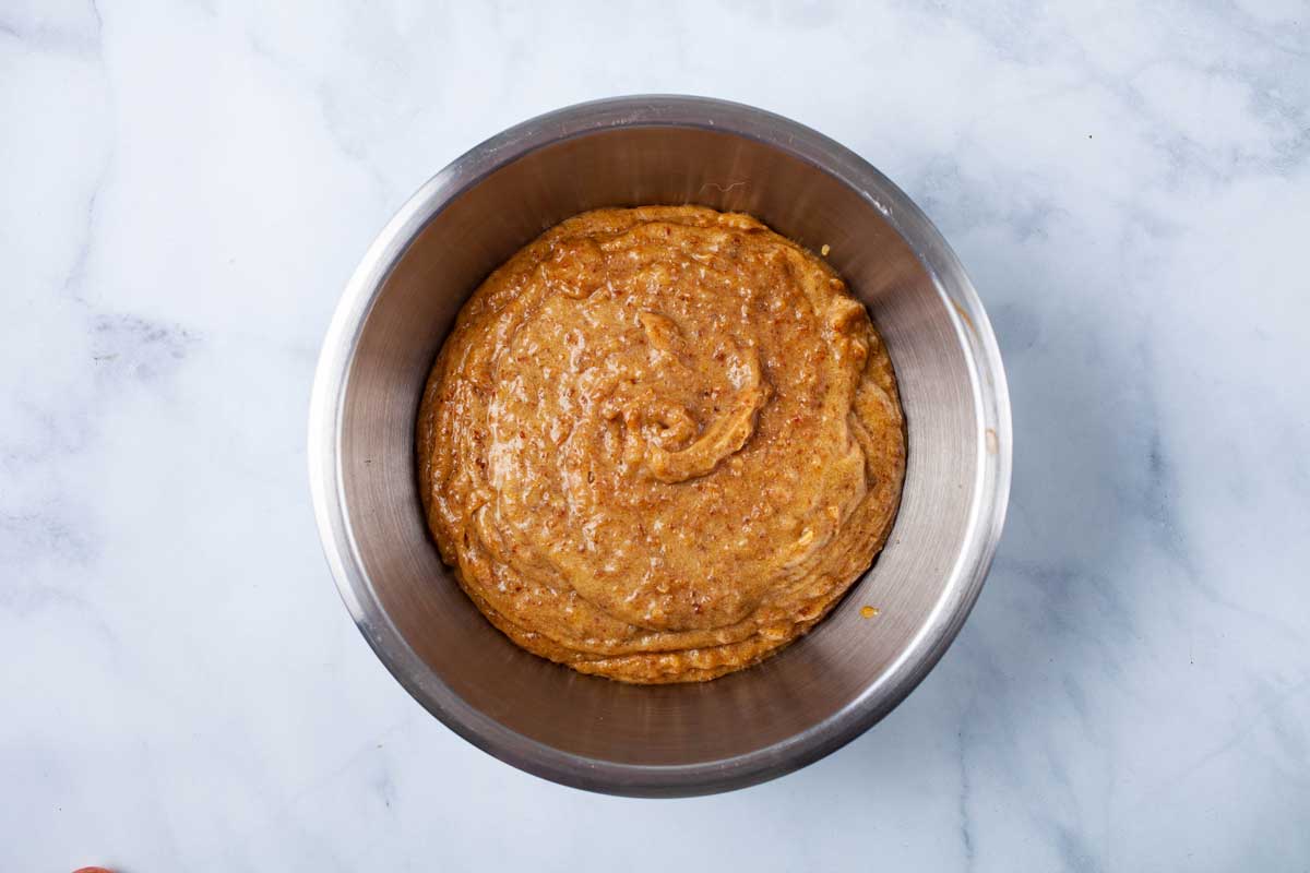 A stainless steel bowl with date paste.