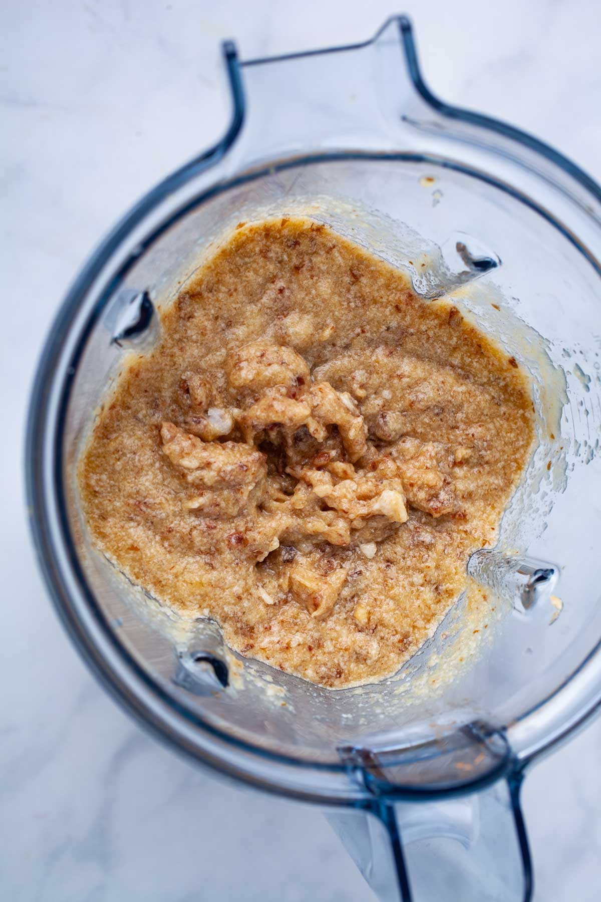 A brownish paste in a blender.