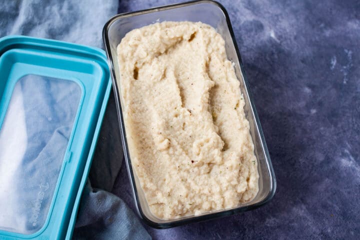 A container filled with prepped cauliflower mash.