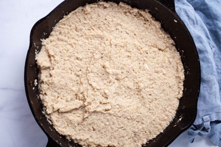 Mashed cauliflower in an iron cast skillet.