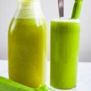 Celery pineapple juice served in a tall glass.