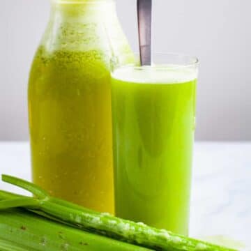 Celery pineapple juice served in a tall glass.