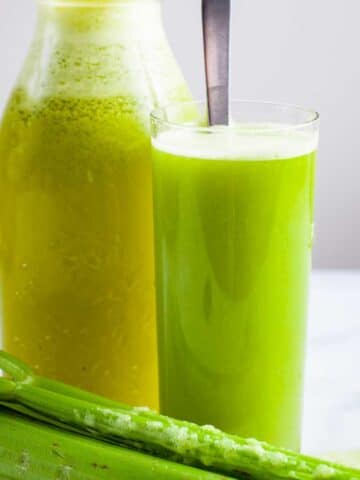 Celery pineapple juice served in a tall glass.