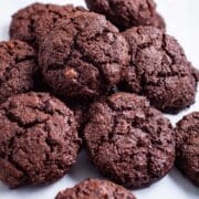 Almond Flour Cocoa Cookies stacked on a table.