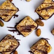 Chocolate covered coconut bites on a plate.