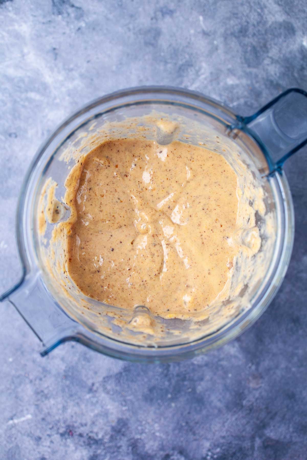 Chocolate mango smoothie blended in a blender.