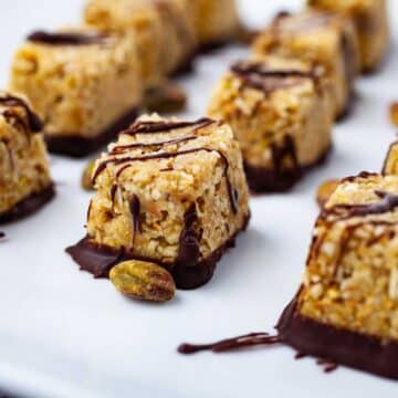 Chocolate covered coconut bites on a plate.