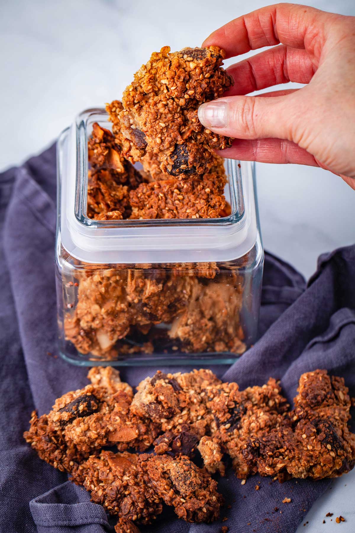 Granola clusters in a glass container.