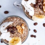 Coffee chia seed pudding in mini cups, topped with walnuts, chopped banana, and coconut flakes.