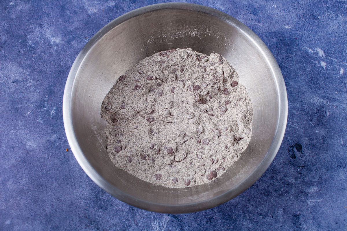 Dry ingredients combined in a stainless steel bowl.