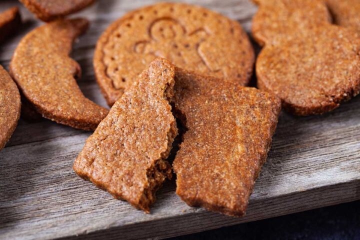 A close-up of a squared cookie snapped in half.