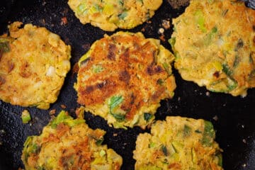 Crispy brown vegetables cakes in a pan.