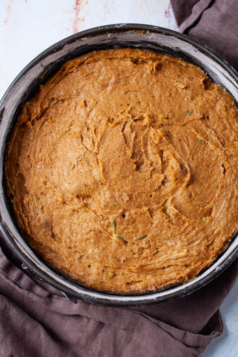 Batter of a coffee cake in a cake pan.