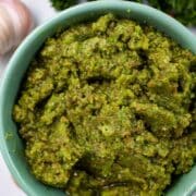 A green Picada pesto in a small serving bowl.