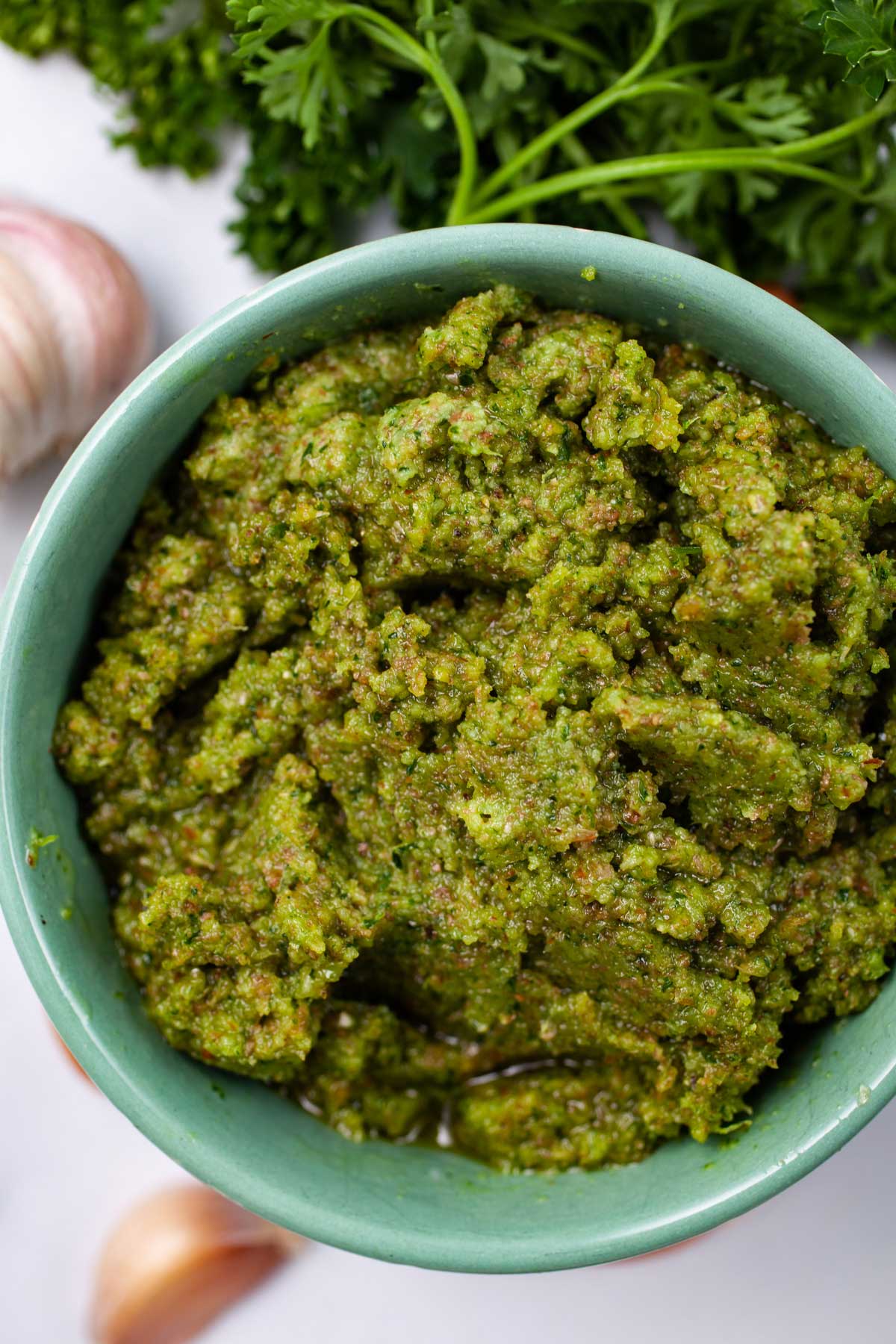 A green Picada pesto in a small serving bowl.