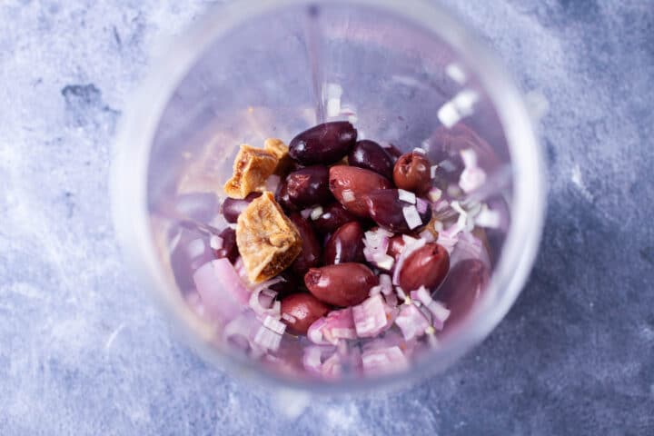 Chopped figs, Kalamata olives, and chopped shallot in a blender.