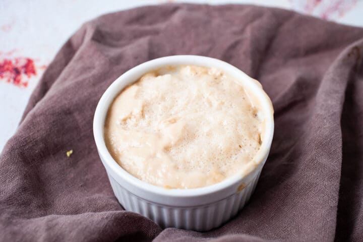 A ramekin filled with leavened yeast.