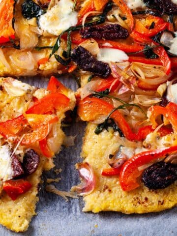 A pizza with polenta crust and veggie toppings