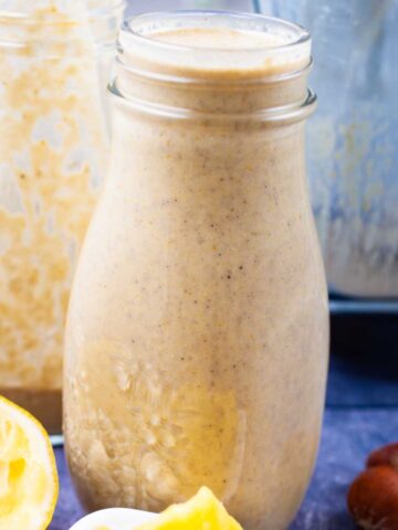 Creamy green banana smoothies on a table.