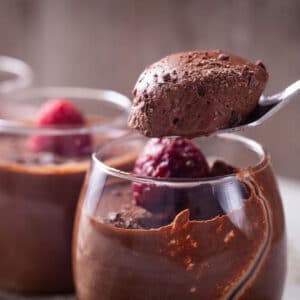 A bite of soft and airy chocolate coffee mousse showcased on a spoon.